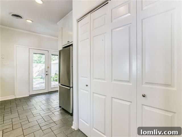 Kitchen view showing glass doors to outdoor space