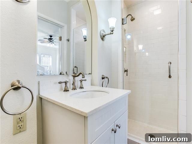 Tastefully updated bathroom with subway tiles and classic fixtures