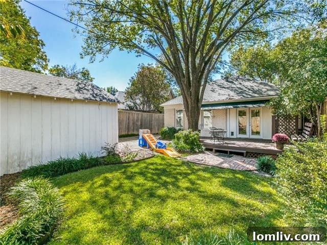 View of the neighborhood street with mature trees