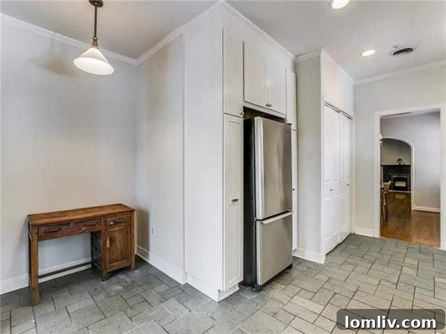 Kitchen sink area with double windows overlooking backyard