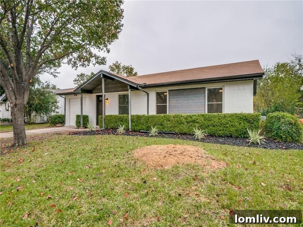 Front entry of renovated Rowlett home with stained wood detail