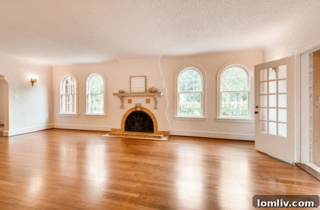 Ruth Story Wins Exclusive Windsor Place Listing 6 Bright and airy living room with a unique serpentine fireplace and original sconces