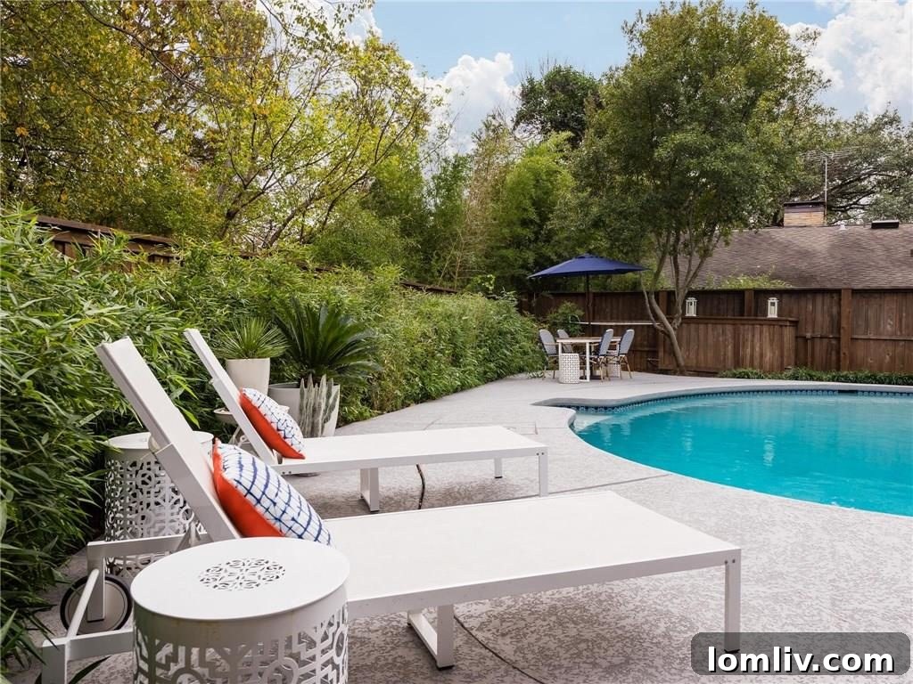 Serene Pool Area with Lush Landscaping at Dusk