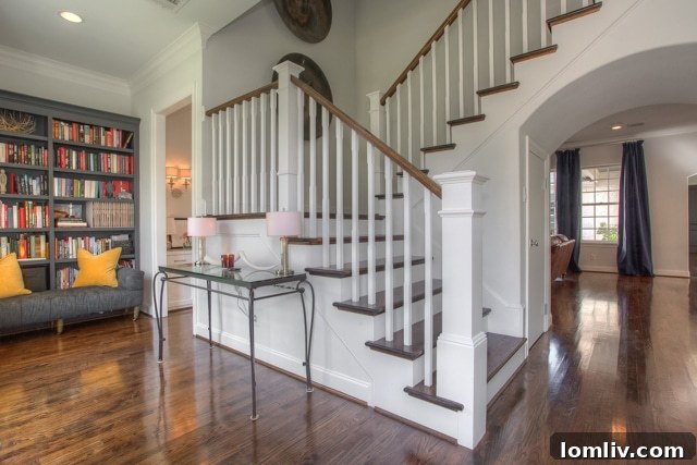 Grand entry staircase and cozy reading nook in a Fort Worth home