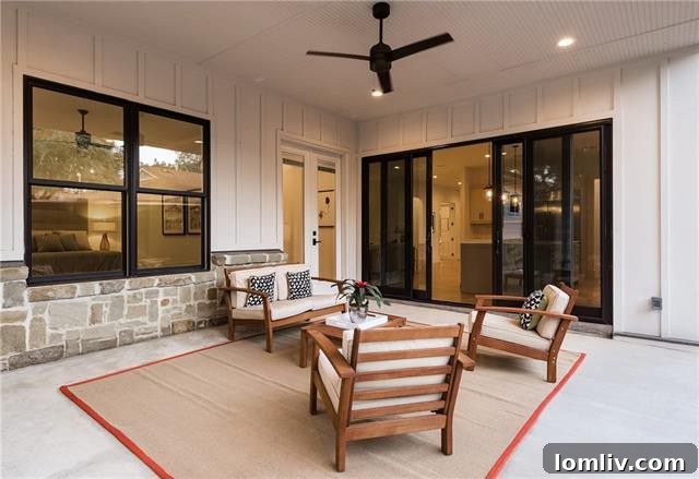 Covered outdoor patio with seating area, ideal for entertaining