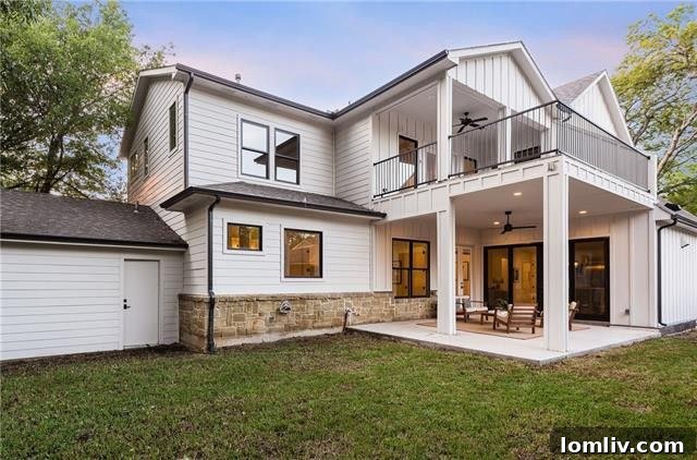 Backyard view of the modern farmhouse with green space