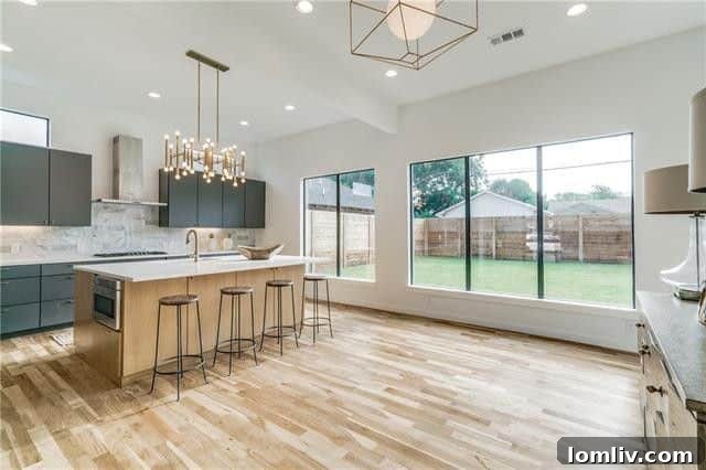 Carrara marble backsplash and modern gold hardware in Dallas kitchen