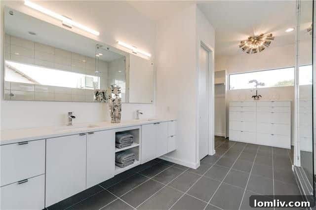 Dual vanity with modern fixtures in contemporary master bath