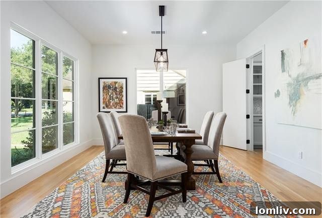 Elegant formal dining room with large windows overlooking garden