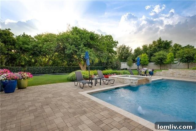 Vanishing edge pool with three waterfalls cascading into a lower water feature