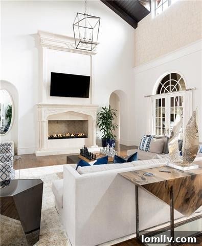 Luxurious great room with custom dark wood ceiling and elegant furnishings