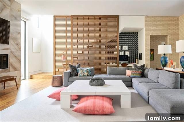 Spacious open concept living room with a large sofa and artistic decor