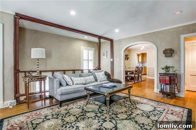 Bright bedroom with hardwood floors in a leased Dallas duplex