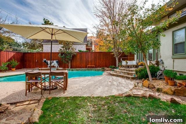 Dining area with view into the modern kitchen and ample natural light at 1214 N. Clinton Ave
