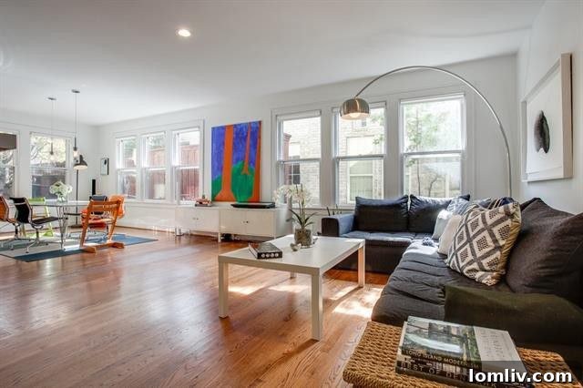 Elegant living space with a prominent central fireplace and large windows at 1214 N. Clinton Ave