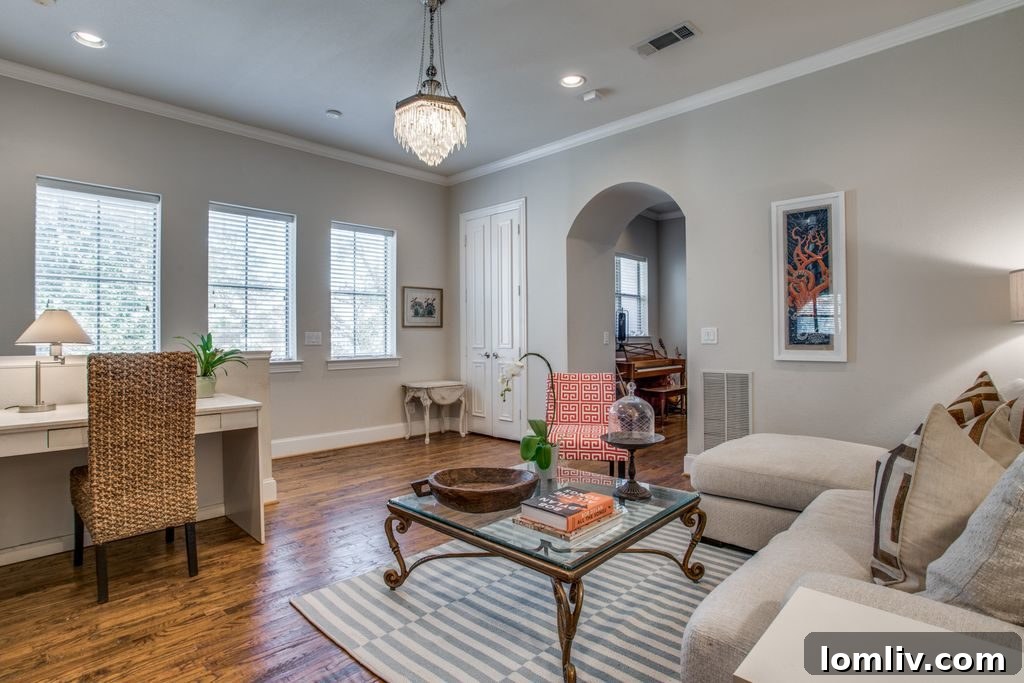 Elegant study with natural light and hardwood floors
