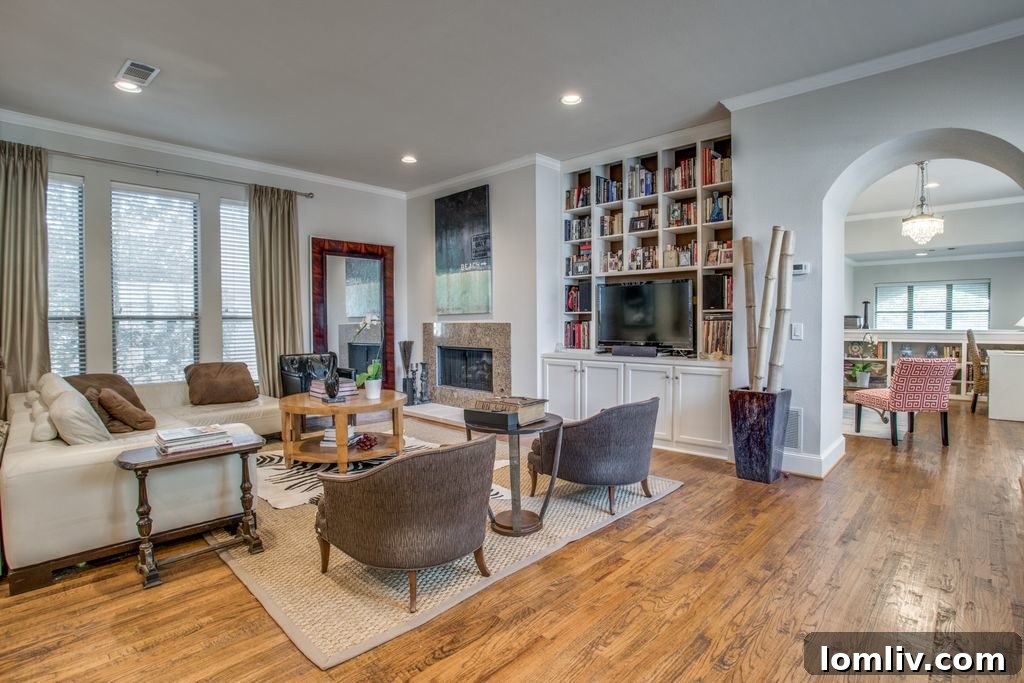 Spacious open-concept family room with fireplace and high ceilings