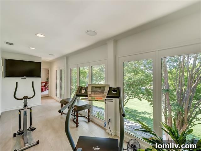 Upper level bedroom currently used as a gym with scenic views