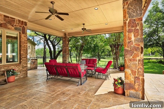 Colleyville: Estate Luxury, Home Comfort 10 Expansive back patio and lush landscaping of the Colleyville luxury estate