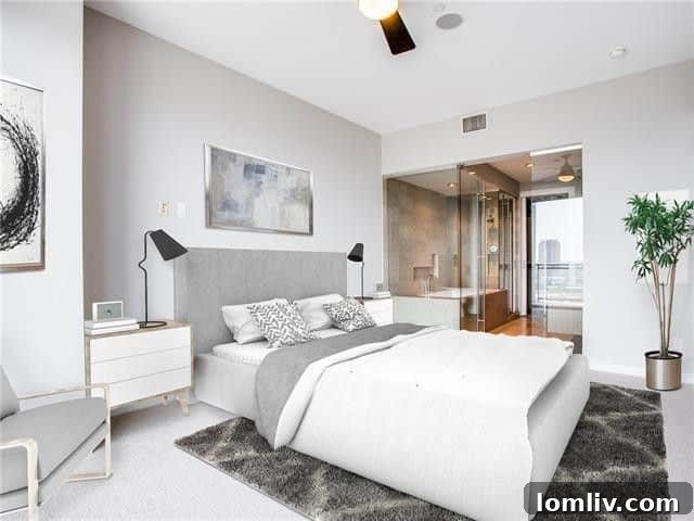Luxurious master bathroom with double vanity and glass shower