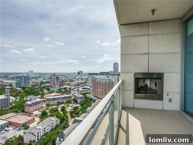 High-rise balcony with outdoor fireplace and stunning city views