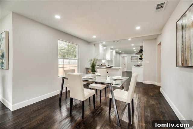 Modern kitchen with white subway tile, open shelving, and stainless steel appliances