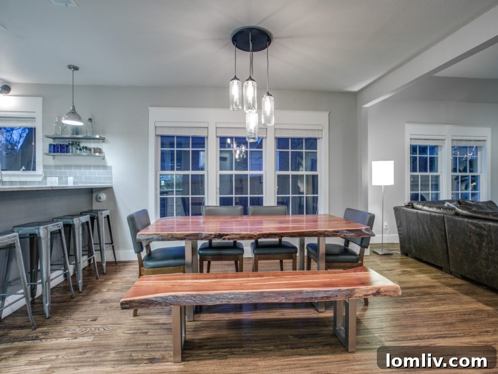 Hollywood Heights Tudor: A Captivating Canvas for Family Celebrations 6 919 Valencia Street Dallas TX - Spacious Dining Room Connecting Kitchen and Living Area