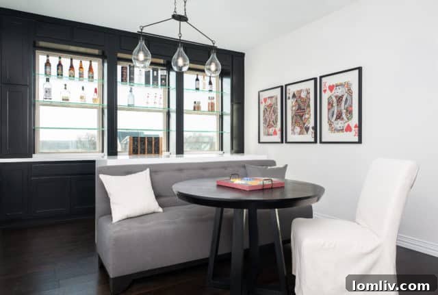 Modern kitchen with light wood flooring and a large island with bar seating