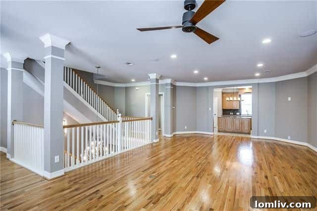 Modern eat-in kitchen with stainless steel appliances and large island in a luxury Dallas townhome.