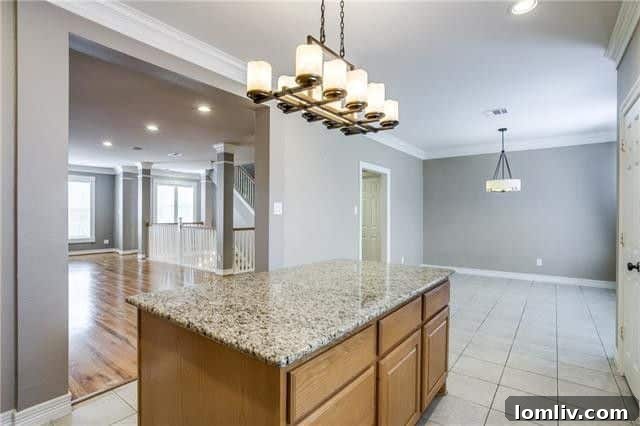 Spacious master bedroom with sitting area, featuring plush carpeting and ample natural light.