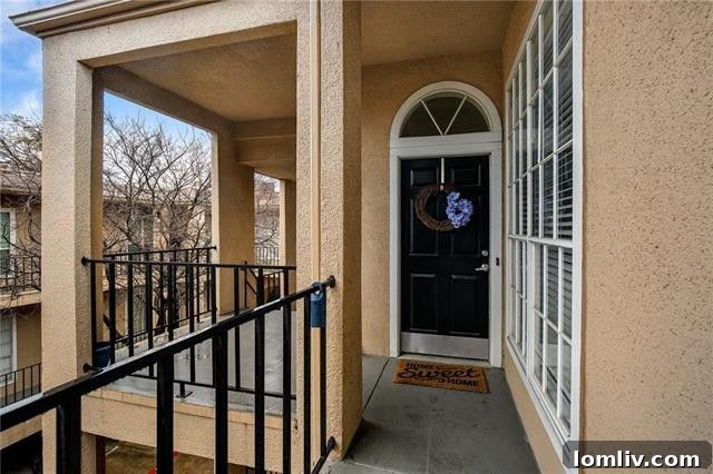 Uptown Starter Condo: Walk to Everything, Own Your City Life 3 Inviting living room with fireplace and balcony access