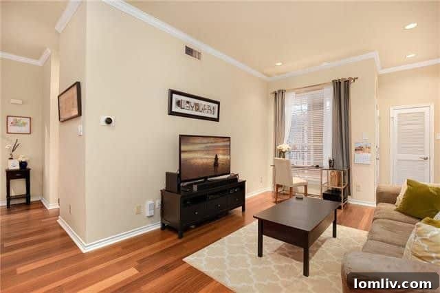 Uptown Starter Condo: Walk to Everything, Own Your City Life 4 Spacious living room looking towards balcony doors
