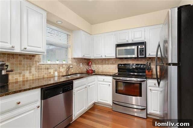 Uptown Starter Condo: Walk to Everything, Own Your City Life 7 Kitchen view showing tile backsplash and sink area