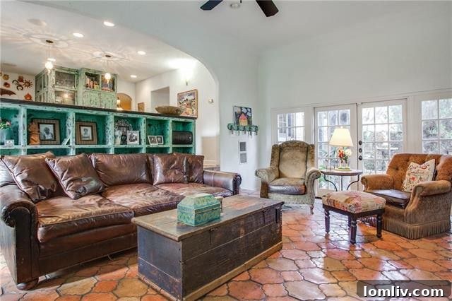 Another bedroom view, possibly the master, featuring elegant decor and architectural elements that highlight the home's historic integrity.