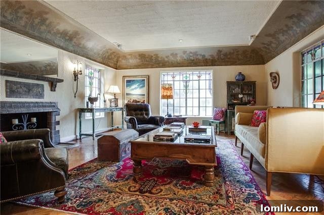 The grand entrance of the Hutsell home, showcasing its intricate Spanish Eclectic architectural style and inviting facade, a true architectural marvel.