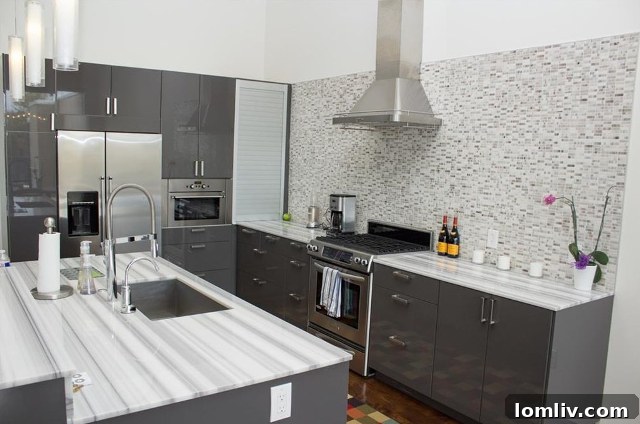 Modern Kitchen with Natural Stone Countertops and Ample Drawer Storage at 2292 Vantage