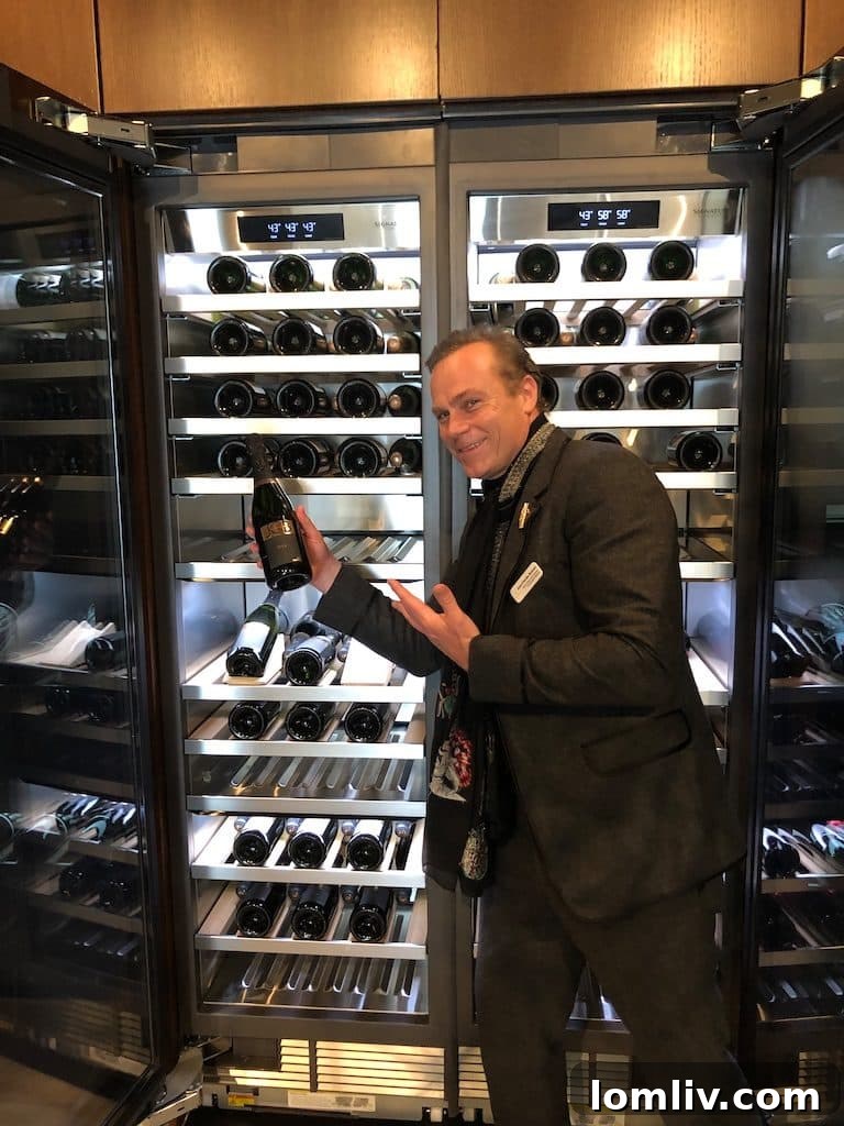 Jean-Charles Boisset examining wine preservation columns at the SKS Experience and Design Center in Napa.