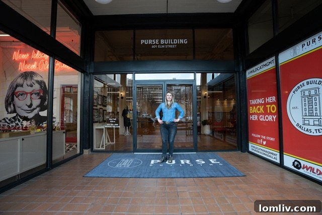 Tanya Ragan, President of Wildcat Management, standing outside the meticulously restored Historic Purse Building in Dallas' West End, showcasing its architectural beauty and inviting presence.