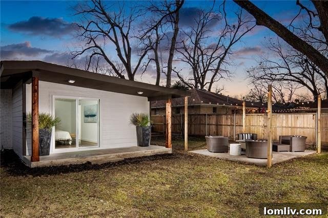 Inviting Covered Patio Overlooking Lush Green Space
