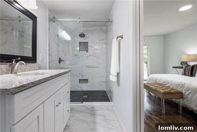 Luxurious Master Bathroom with Curbless Walk-in Shower and Rain Showerhead