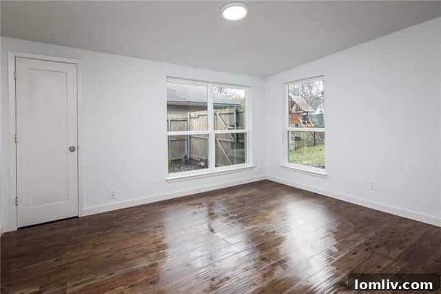 One of Three Well-Appointed Bedrooms with Hardwood Flooring