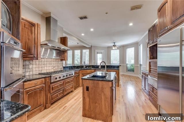 Gourmet kitchen with Subzero refrigerator in 212 Brazos Lane