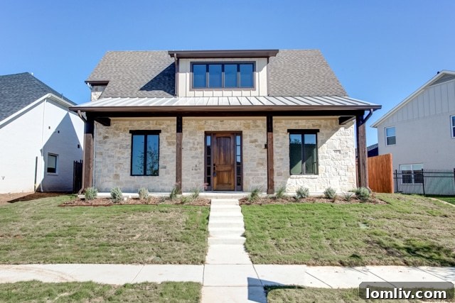 The charming covered front porch of 527 Trail Rider Road, highlighting the community-focused design of River Heights.