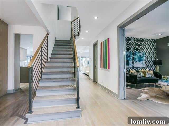 Lakewood Tudor's Modern Renaissance 4 Elegant living area with classic fireplace and modern decor