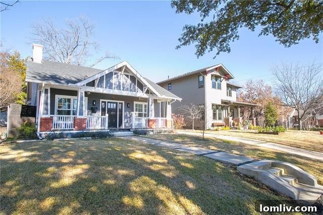 Inviting front porch and entrance of the Craftsman-style home in Dallas's Vickery Place.