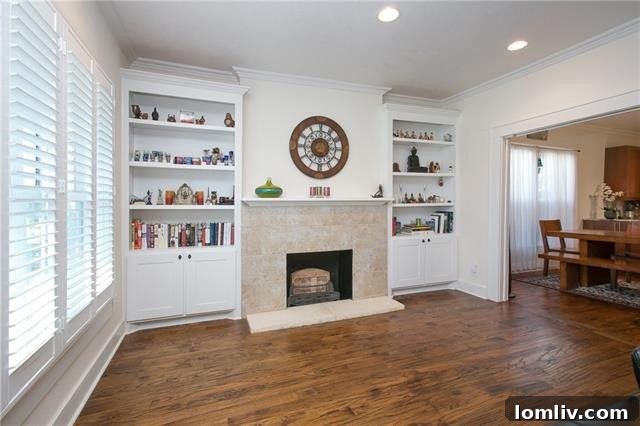 Bright dining area with elegant lighting and views of the backyard in 5455 Vickery Blvd.