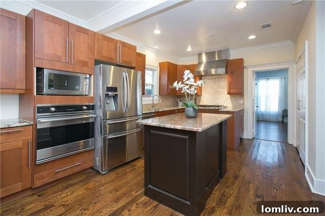Modern kitchen with extensive cabinetry, a central island, and high-end Viking appliances.