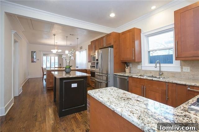 Detail view of the custom cabinets and kitchen island in the renovated M Streets home.