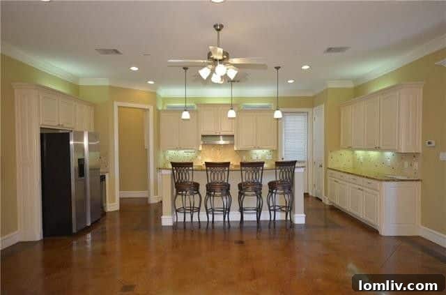 Open-concept living and dining area with modern finishes in the Dallas M Streets home.