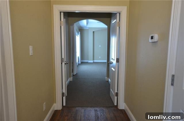 Gourmet kitchen featuring a large island, Viking appliances, and custom cabinetry in Dallas home.
